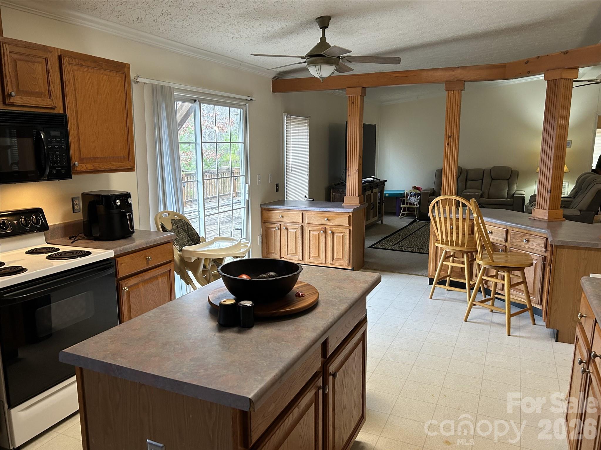 322 Balmy Lane Rutherfordton, NC 28139 - Photo 16 of 34 a kitchen with a stove a sink and a refrigerator