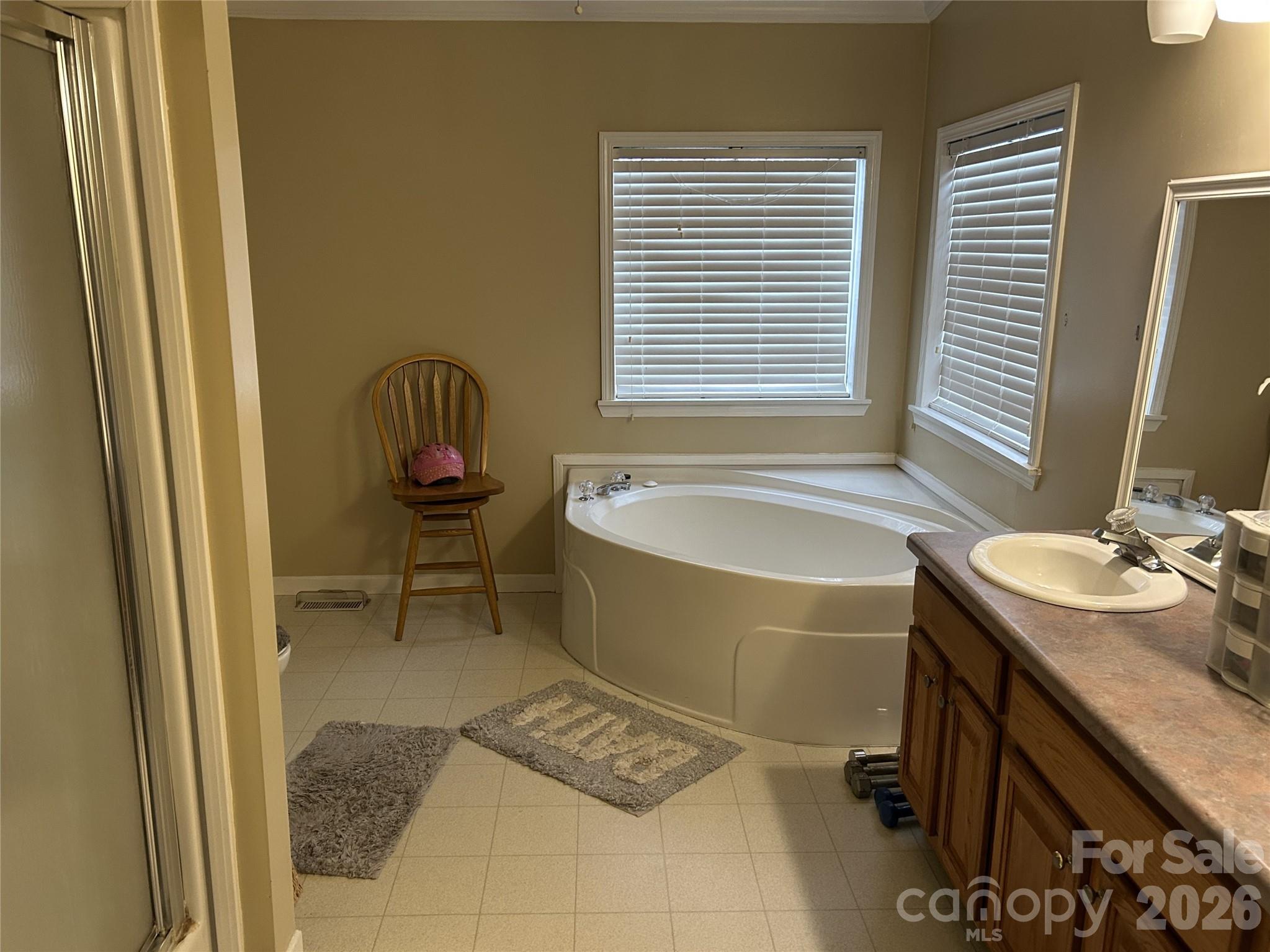 322 Balmy Lane Rutherfordton, NC 28139 - Photo 20 of 34 a bathroom with a granite countertop sink and a bathtub