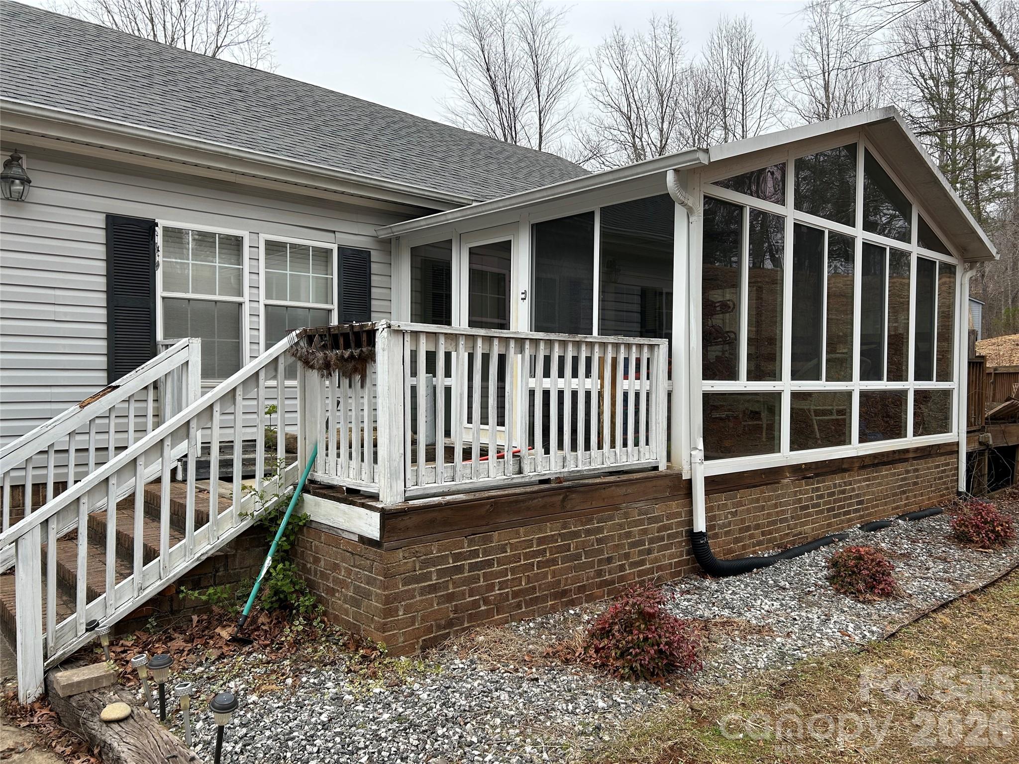 322 Balmy Lane Rutherfordton, NC 28139 - Photo 4 of 34 a view of a wooden house with wooden fence