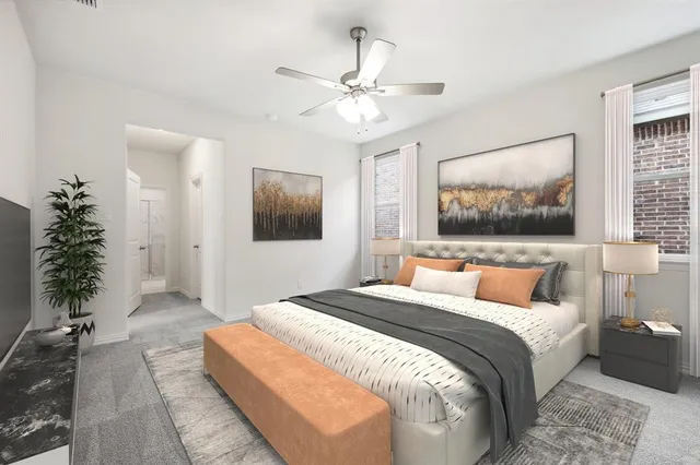 a bedroom with a large bed and a chandelier