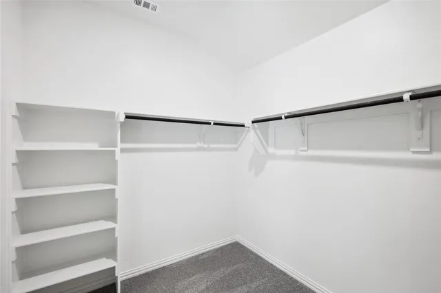 a view of an empty walk in closet