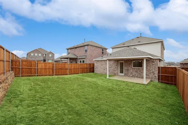 a view of a front of house with yard and deck