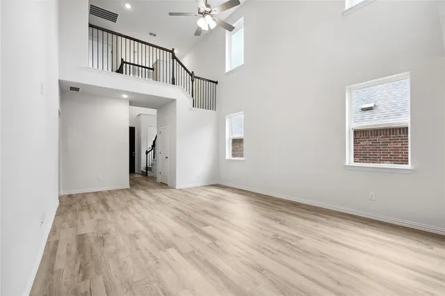 a view of an entryway with wooden floor