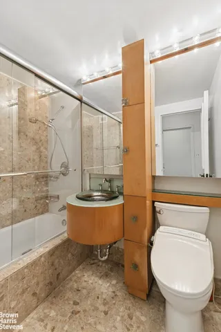 a bathroom with a toilet a sink and bathtub