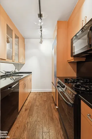a kitchen with a stove and a microwave