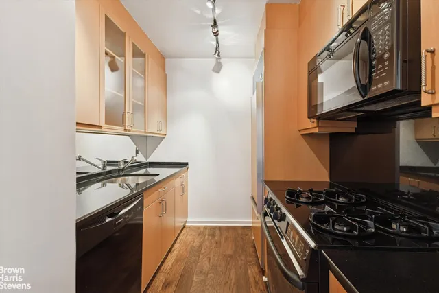 a living room with furniture a lamp and a window