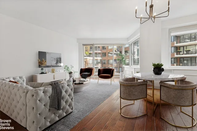 a bedroom with a large bed and a couch