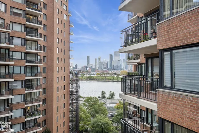 a living room with furniture a flat screen tv and a window