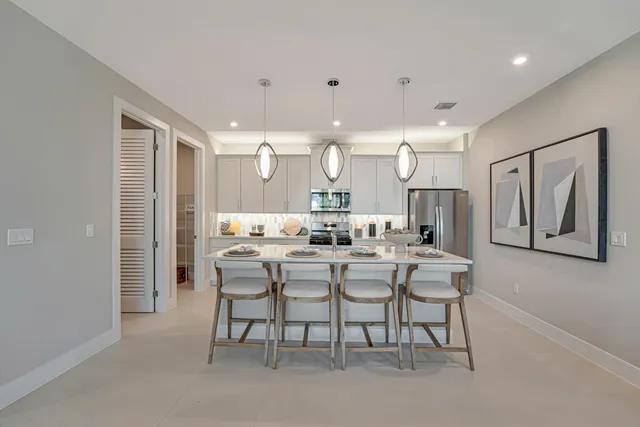 a bathroom with a sink a mirror and vanity