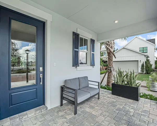a outdoor living space with furniture and potted plants