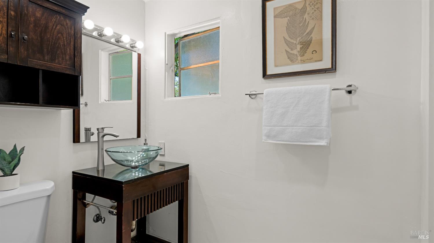 38 Bret Avenue San Rafael, CA 94901 - Photo 33 of 52 a bathroom with a sink a mirror and a toilet