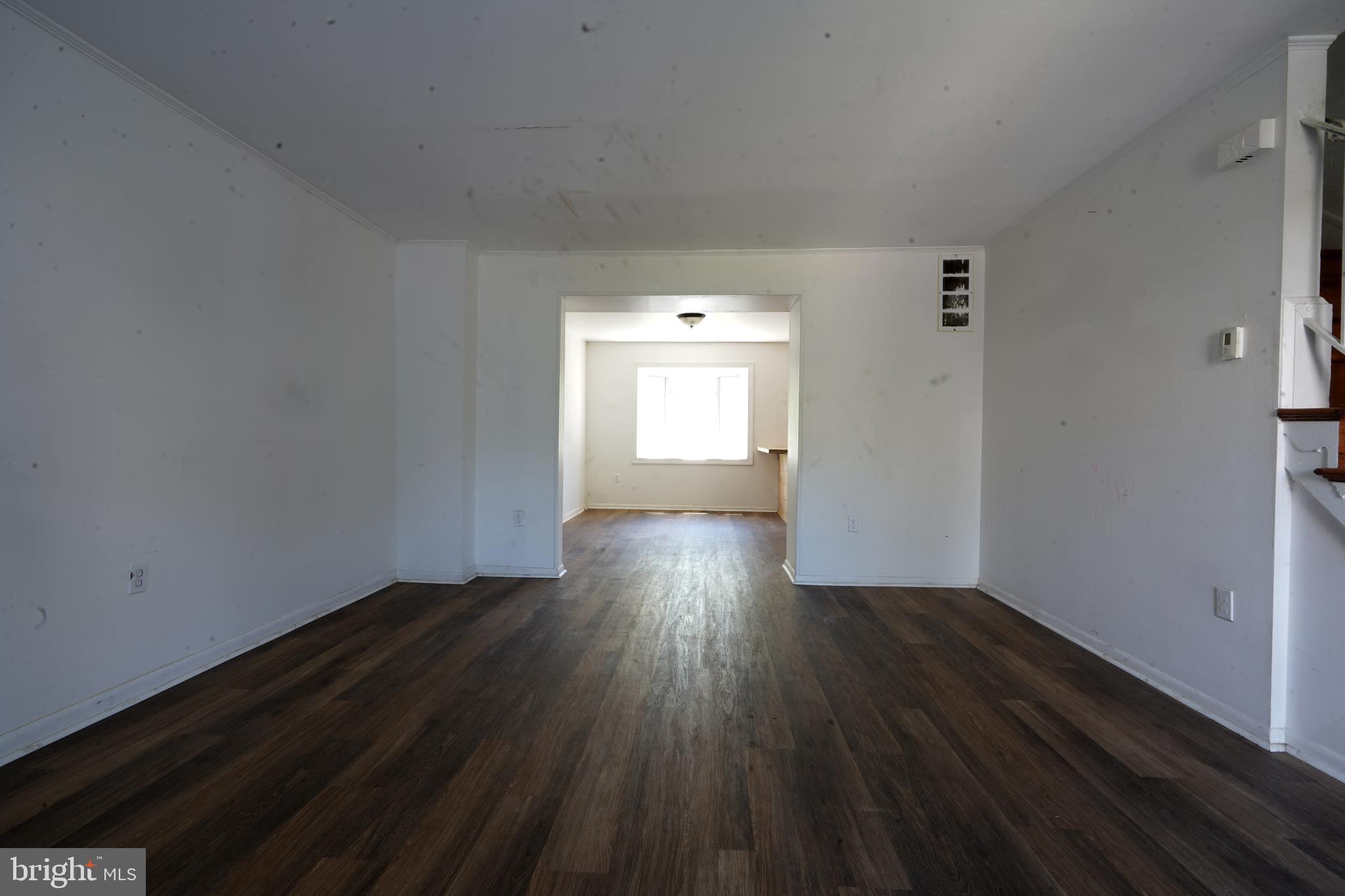 12836 Claxton Drive, Unit 4E Laurel, MD 20708 - Photo 6 of 13 a view of a room with wooden floor and window