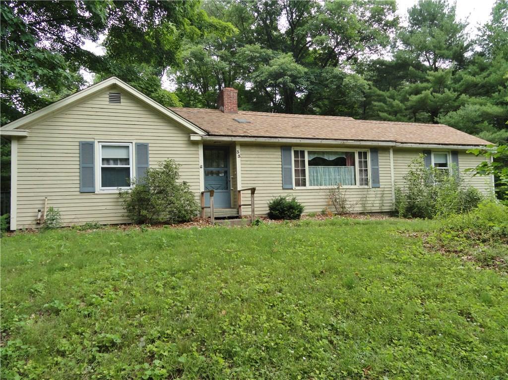 a view of a house with yard and a garden