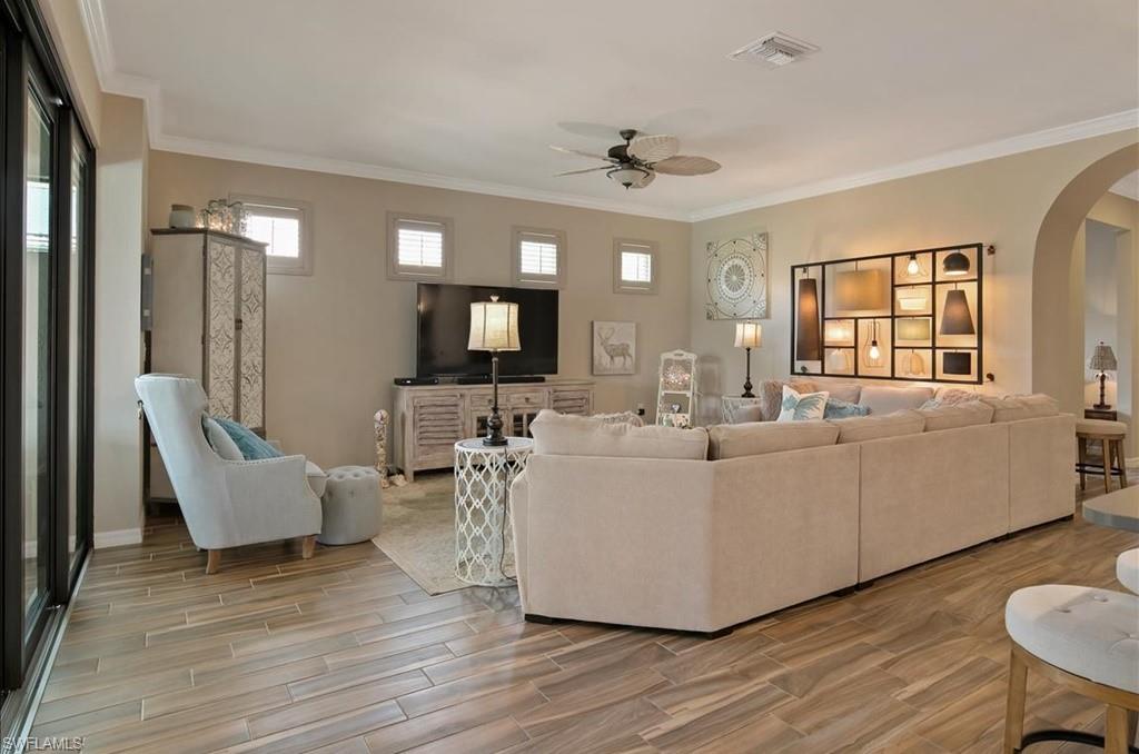 10809 Dennington Road Fort Myers, FL 33913 - Photo 11 of 30 a living room with furniture and a flat screen tv