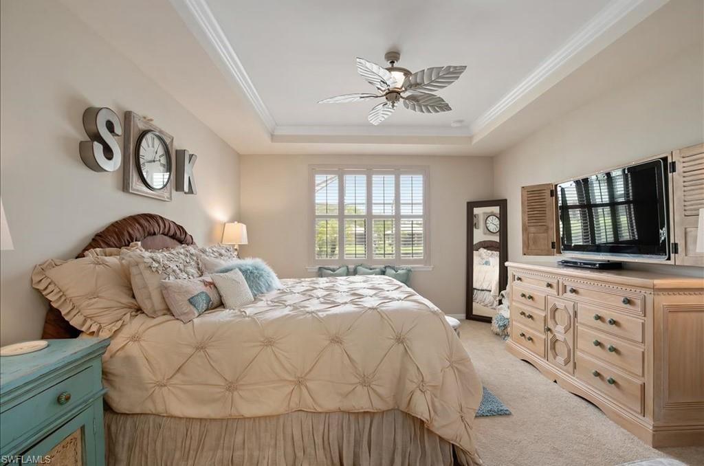 10809 Dennington Road Fort Myers, FL 33913 - Photo 15 of 30 a bedroom with a bed and a flat tv screen on dresser