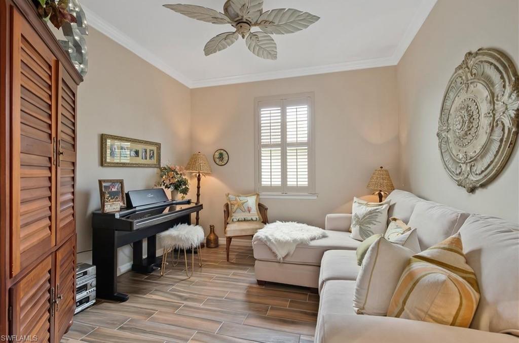 10809 Dennington Road Fort Myers, FL 33913 - Photo 20 of 30 a living room with furniture a clock on wall and a window