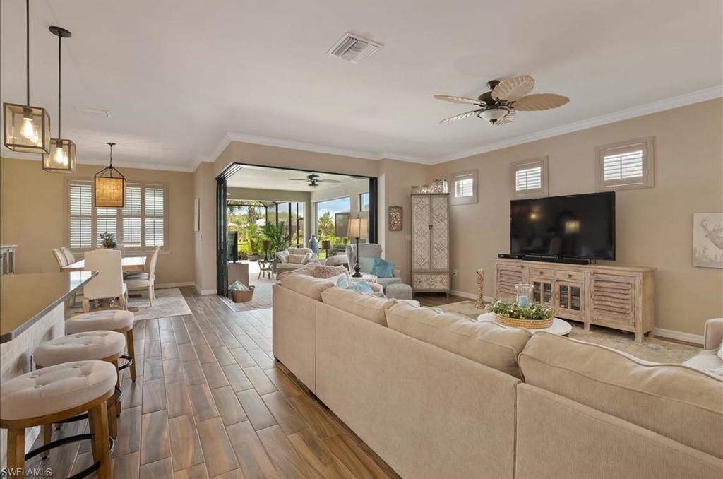 10809 Dennington Road Fort Myers, FL 33913 - Photo 3 of 30 a living room with furniture and a flat screen tv