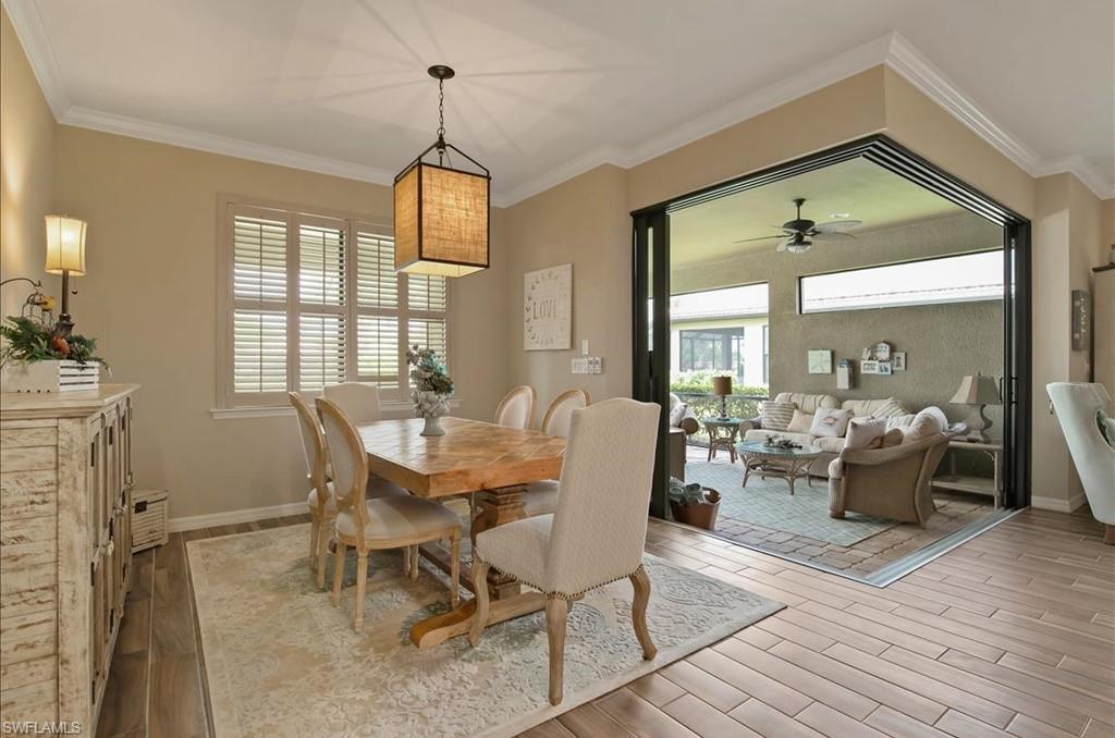 10809 Dennington Road Fort Myers, FL 33913 - Photo 4 of 30 a view of a dining room with furniture window and wooden floor