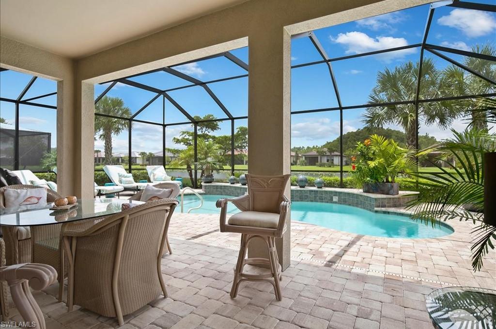 10809 Dennington Road Fort Myers, FL 33913 - Photo 7 of 30 a dining room with furniture and a floor to ceiling window