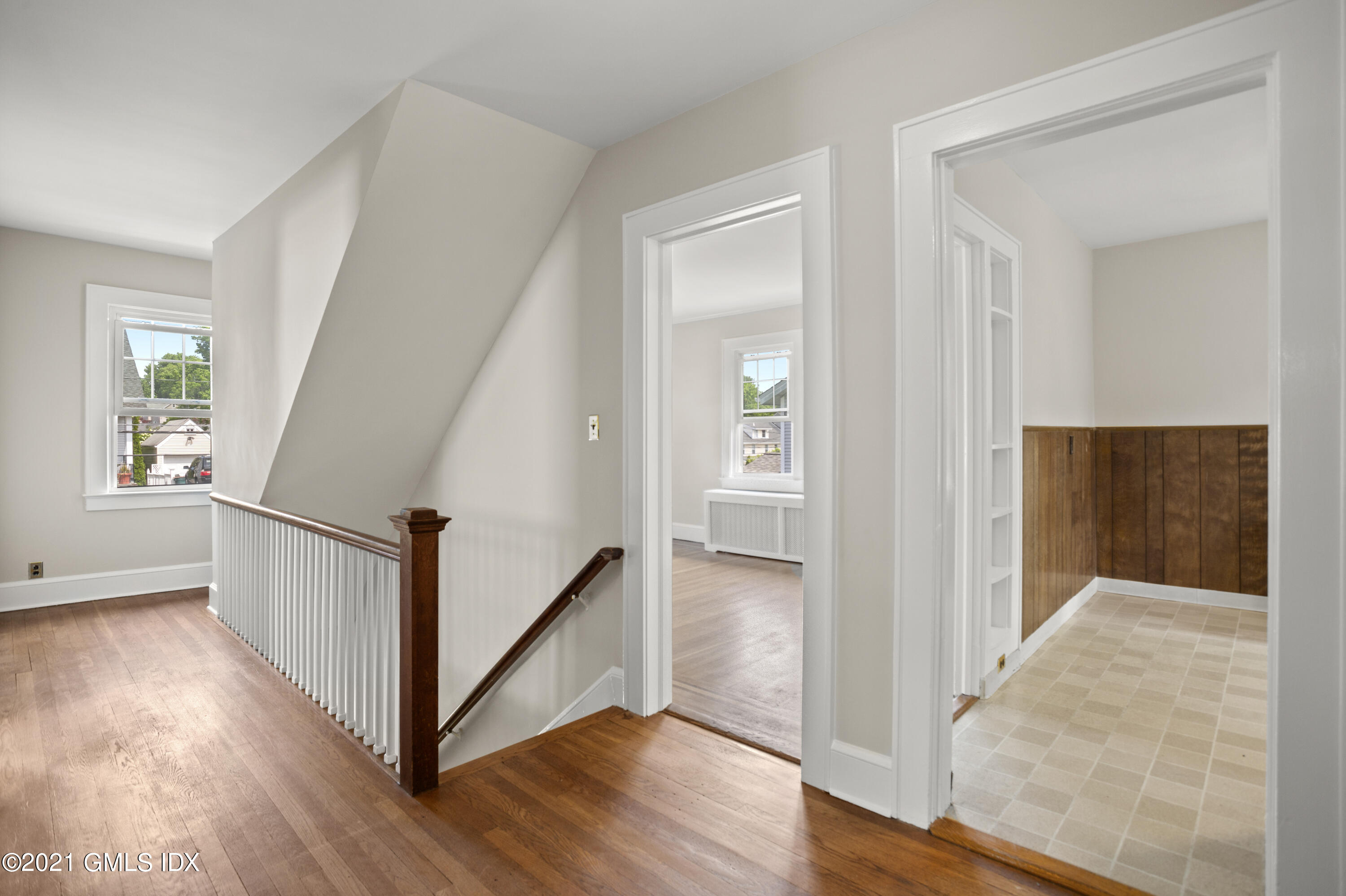 53 Richland Road Greenwich, CT 06830 - Photo 13 of 20 a view of hallway with stairs and wooden floor
