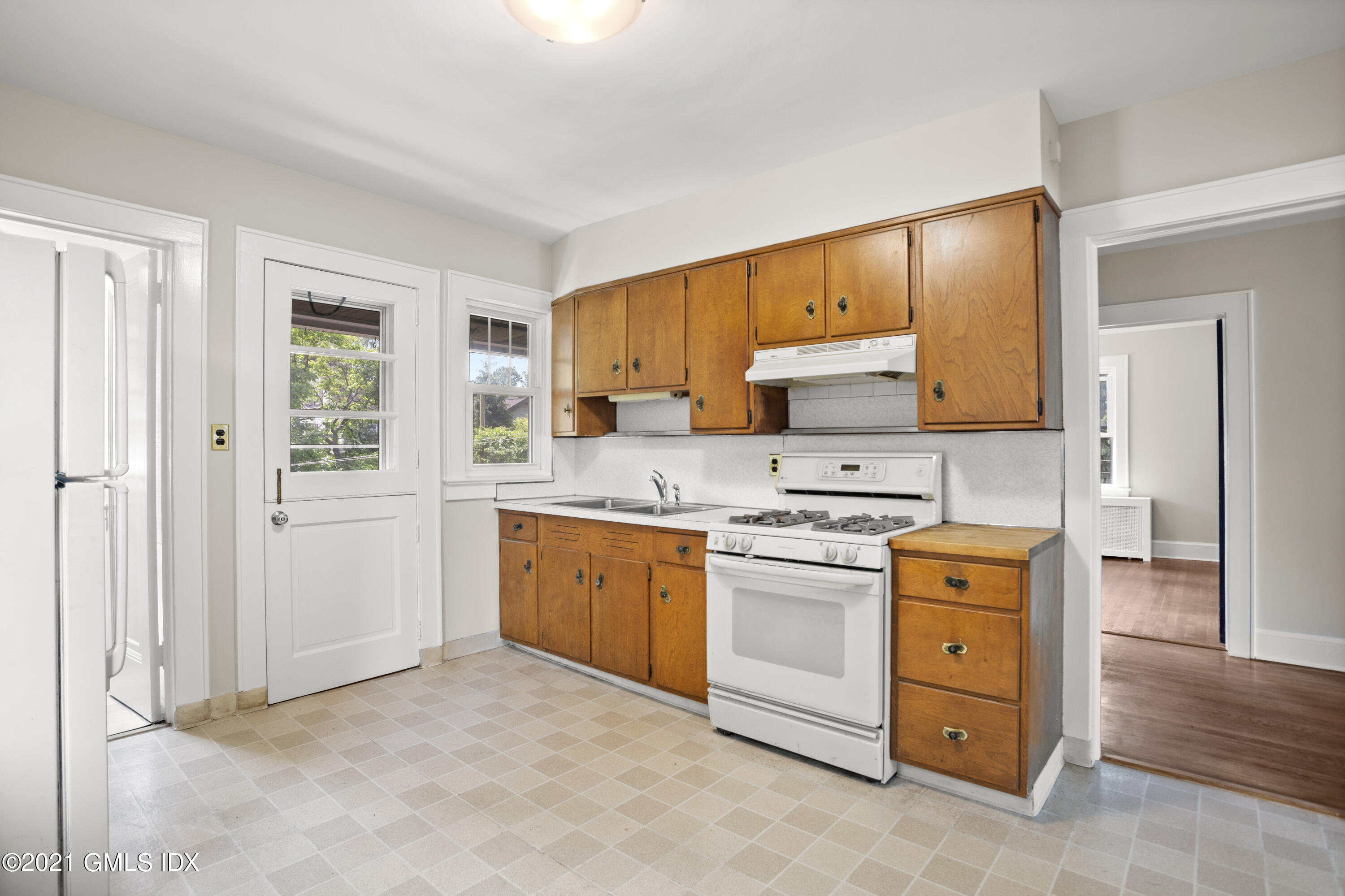 53 Richland Road Greenwich, CT 06830 - Photo 8 of 20 a kitchen with granite countertop a stove top oven sink and cabinets