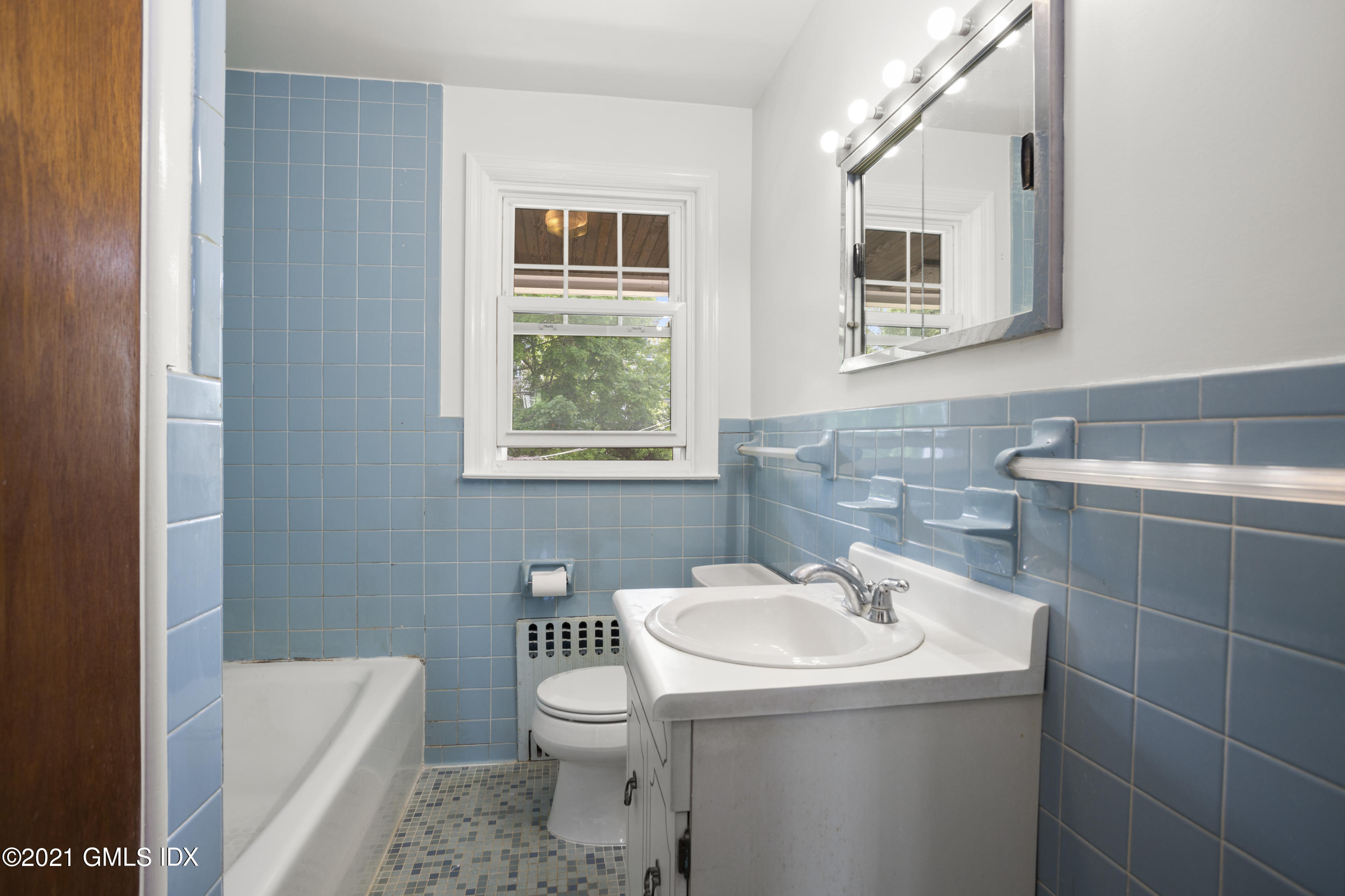 53 Richland Road Greenwich, CT 06830 - Photo 10 of 20 a bathroom with a sink a toilet and shower