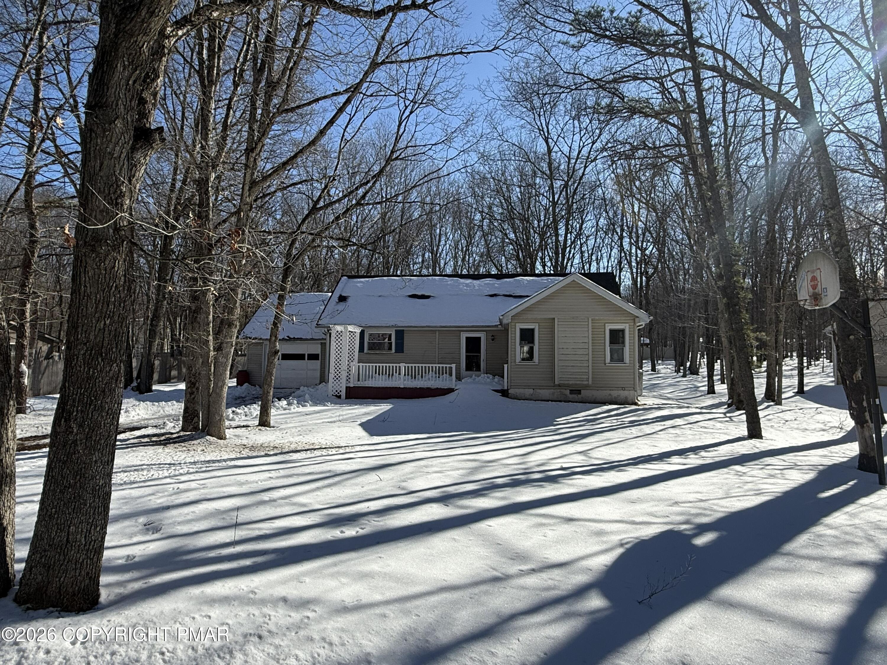 118 Buckhill Road Albrightsville, PA 18210 - Photo 2 of 17 a house with trees in front of it