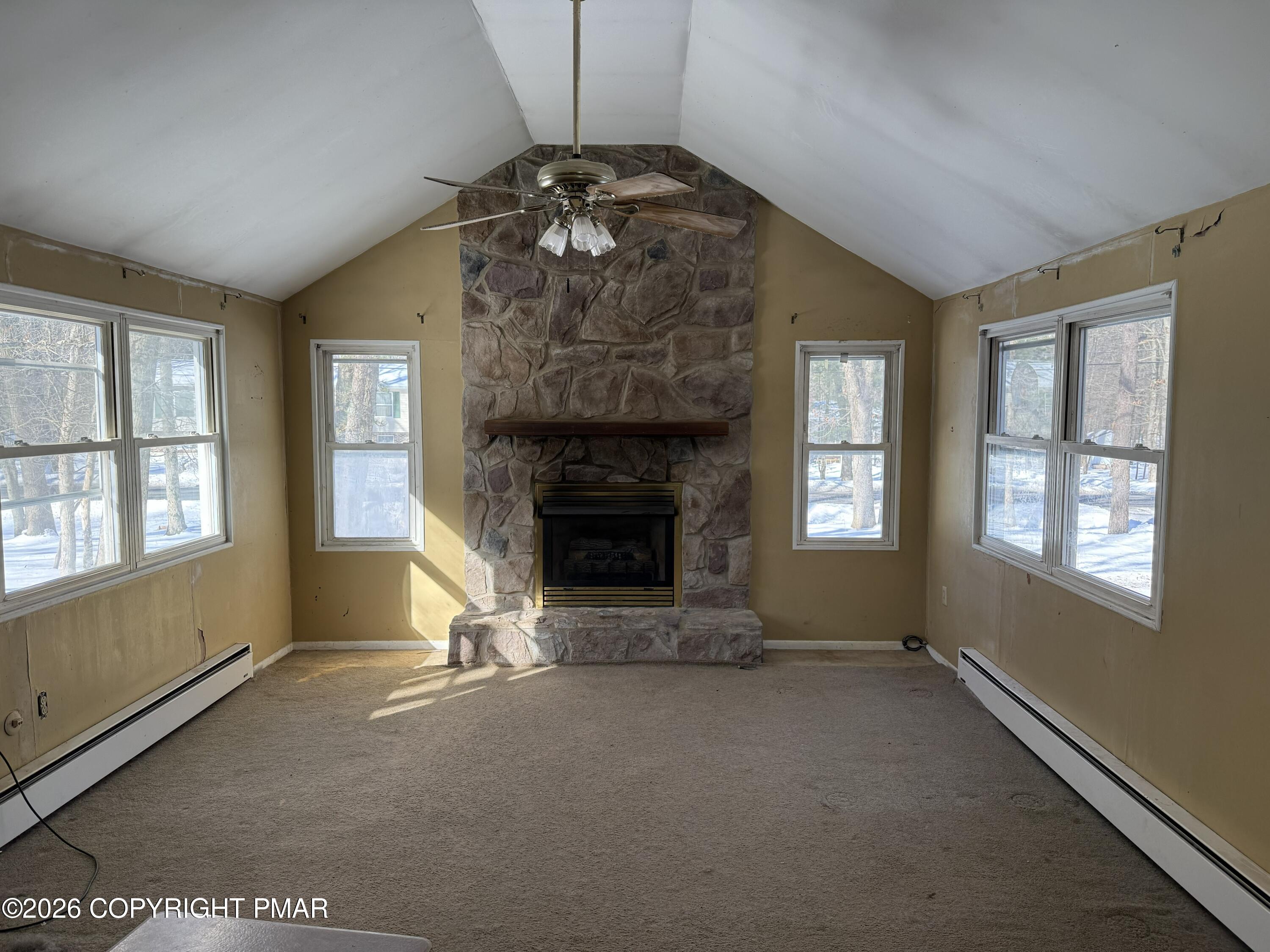 118 Buckhill Road Albrightsville, PA 18210 - Photo 3 of 17 an empty room with windows and fireplace