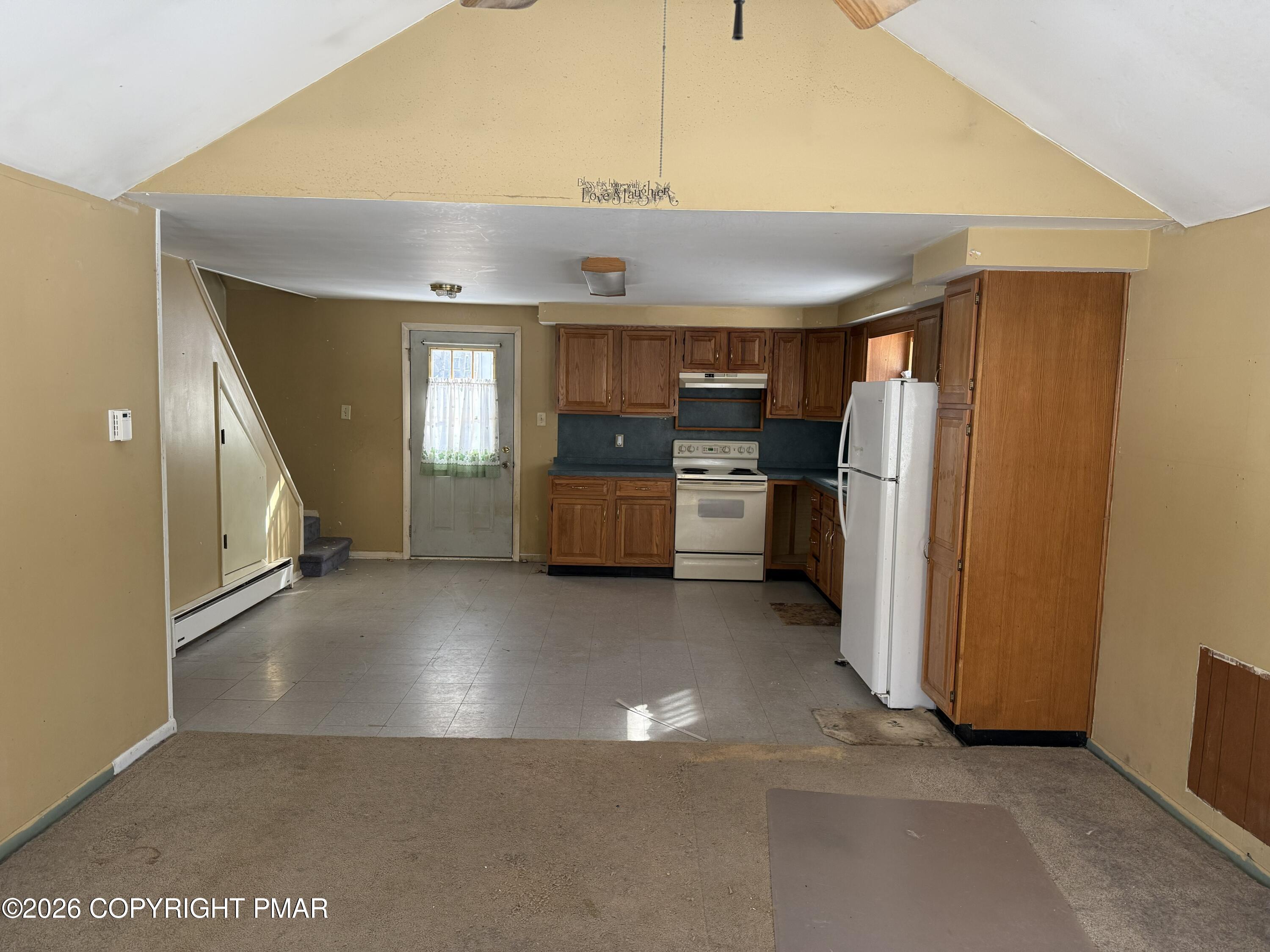 118 Buckhill Road Albrightsville, PA 18210 - Photo 4 of 17 a view of a refrigerator in kitchen and utility room