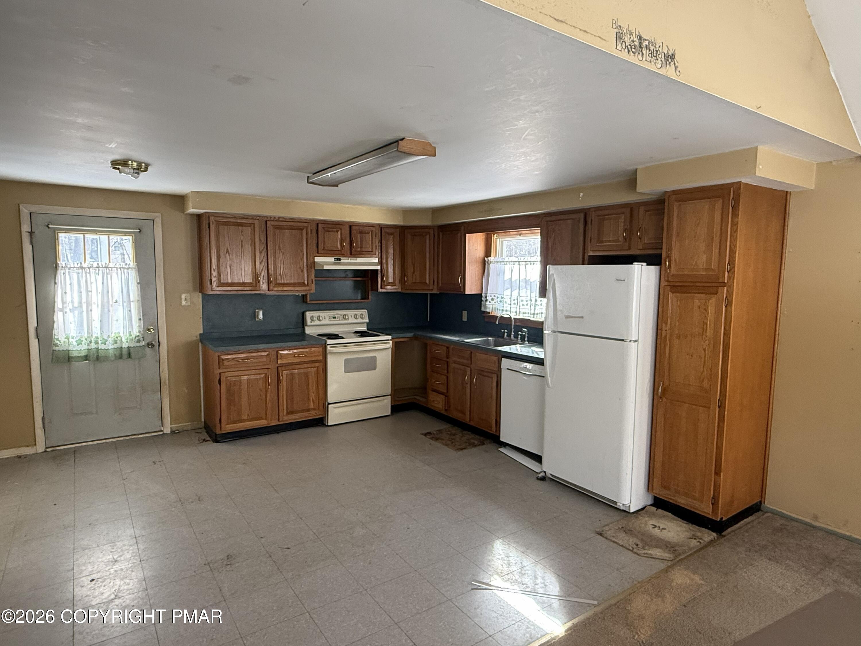 118 Buckhill Road Albrightsville, PA 18210 - Photo 5 of 17 a kitchen with sink a refrigerator and cabinets