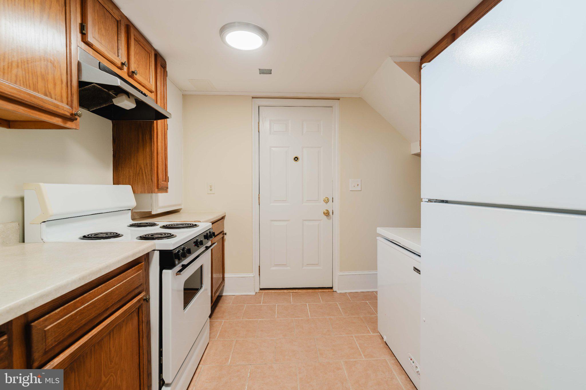 10200 Duvawn Place Silver Spring, MD 20902 - Photo 29 of 42 Cozy kitchen with modern finishes.