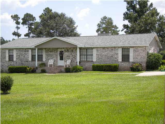 1991 Well Line Road Cantonment, FL 32533 - Photo 1 of 20 BEAUTIFUL HOME BUT A MUST TO SEE INSIDE AND SURROUNDING GROUNDS. A FULL 5.04 ACRE'S GO WITH THIS LOVELY HOME.