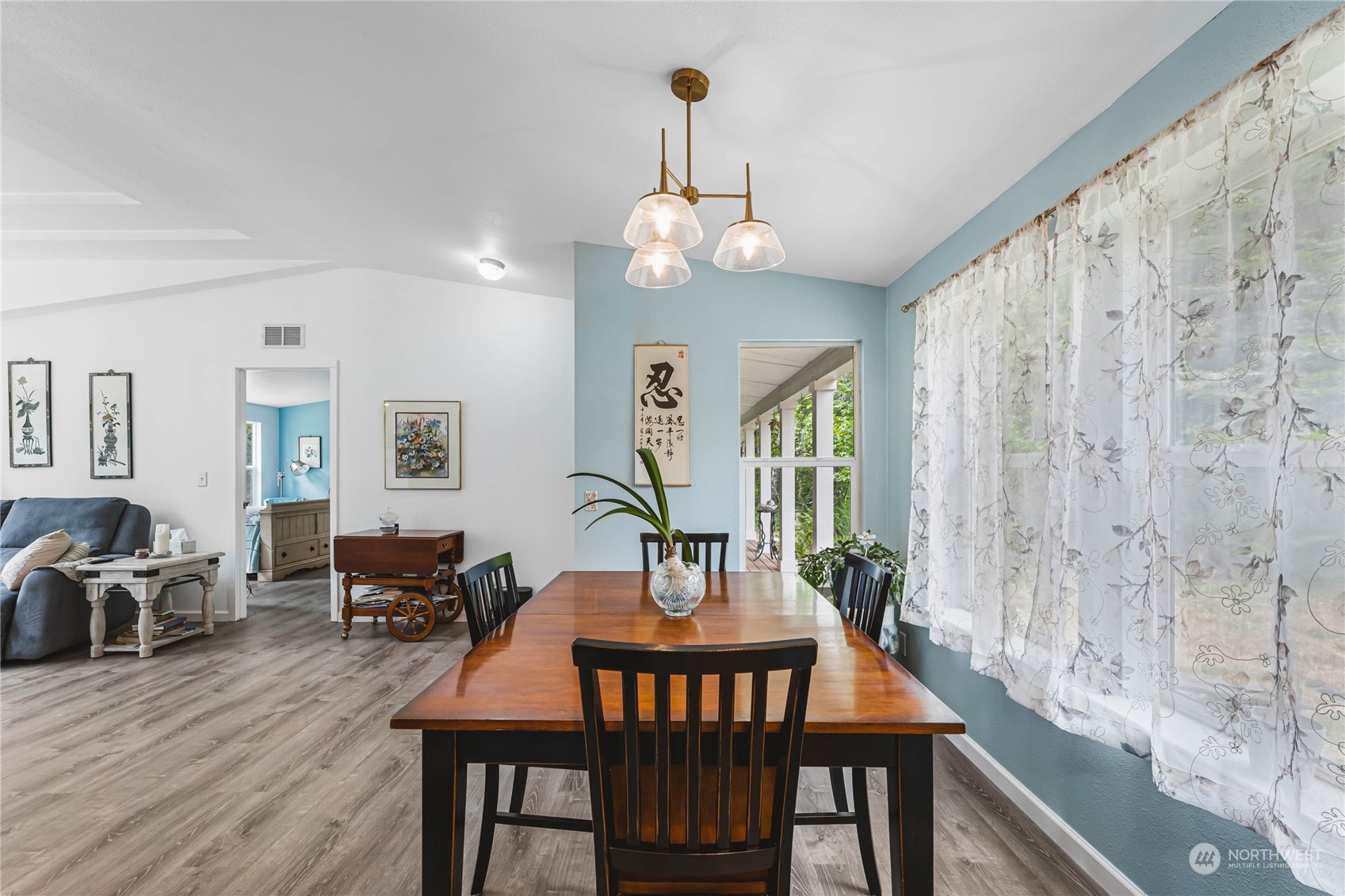 696 Oppelt Road Chehalis, WA 98532 - Photo 6 of 40 a view of a dining room with furniture window and wooden floor