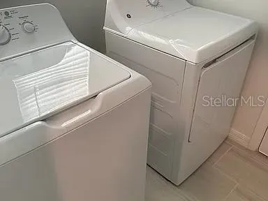 a utility room with dryer and washer