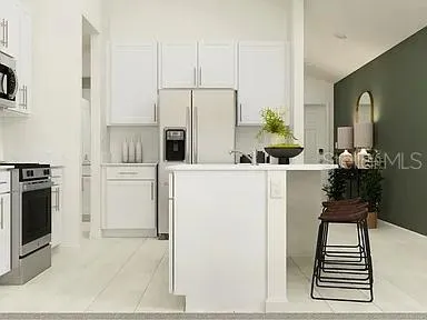 a kitchen with stainless steel appliances a sink and a refrigerator
