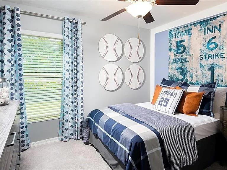 35008 Ackley Trace Zephyrhills, FL 33541 - Photo 7 of 11 a bedroom with a large bed and a window