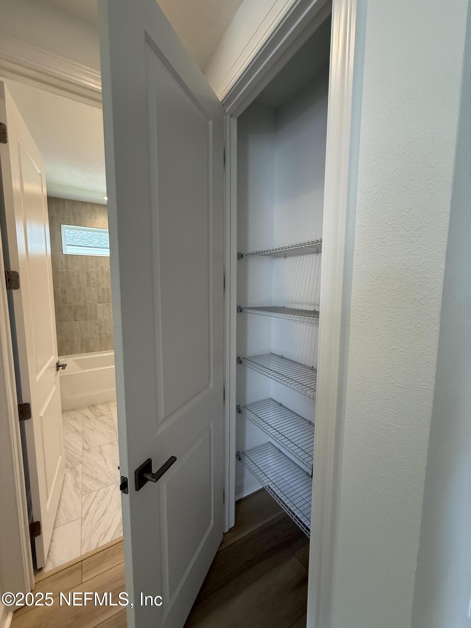 34 Mulberry Road Palm Coast, FL 32164 - Photo 11 of 63 a view of a walk in closet