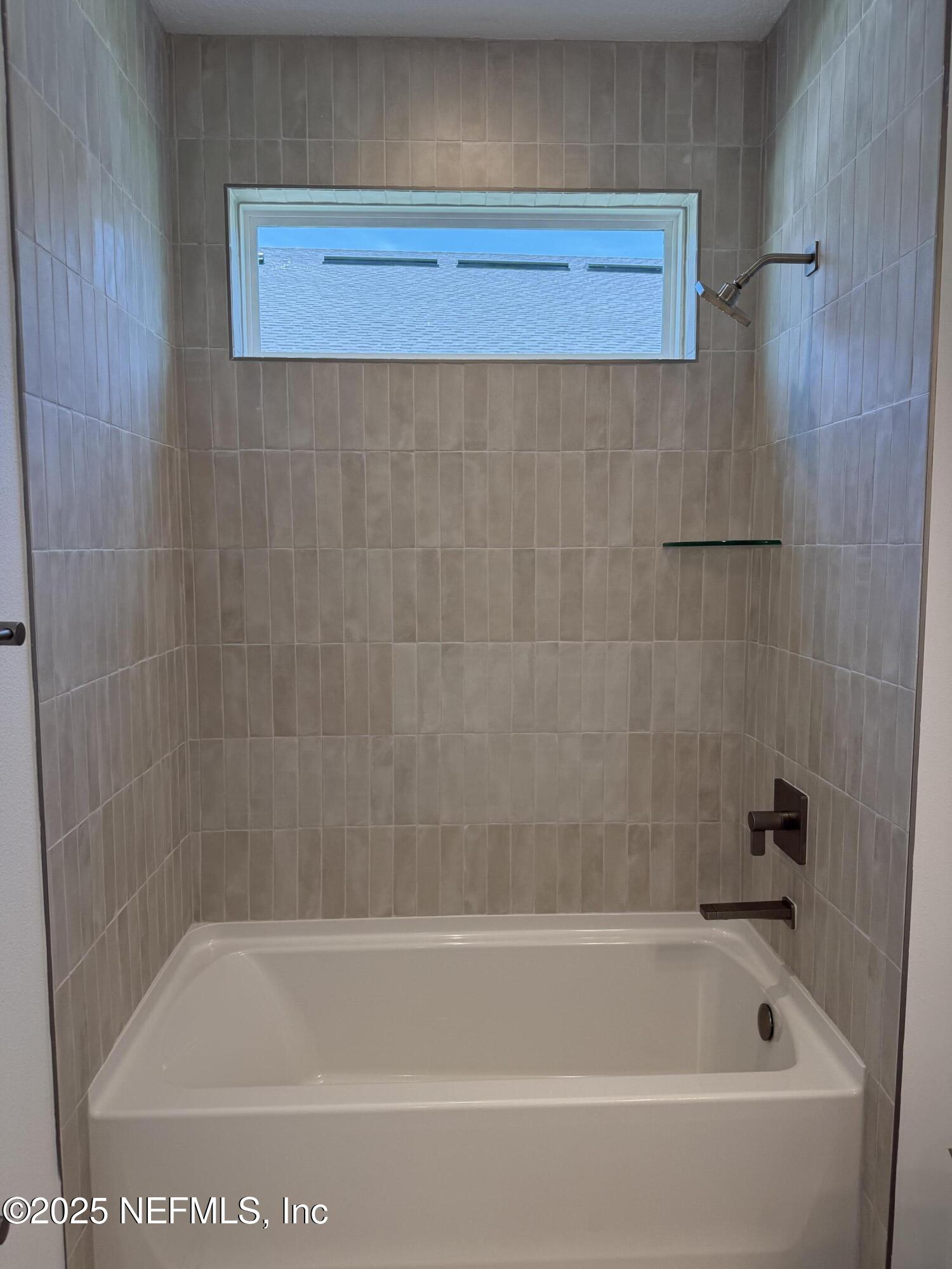 34 Mulberry Road Palm Coast, FL 32164 - Photo 13 of 63 a bathroom with a bathtub
