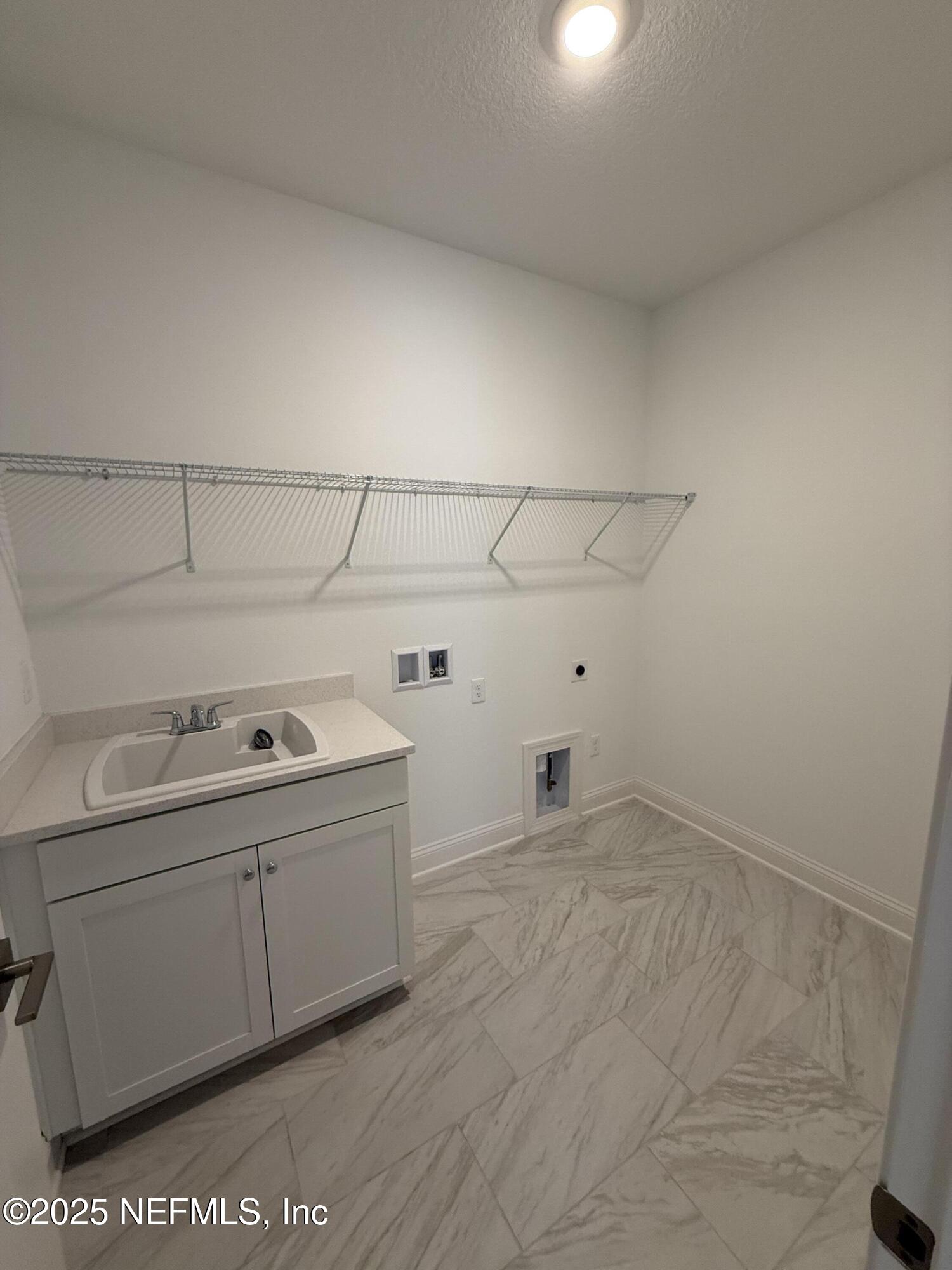 34 Mulberry Road Palm Coast, FL 32164 - Photo 27 of 63 a view of a storage & utility room