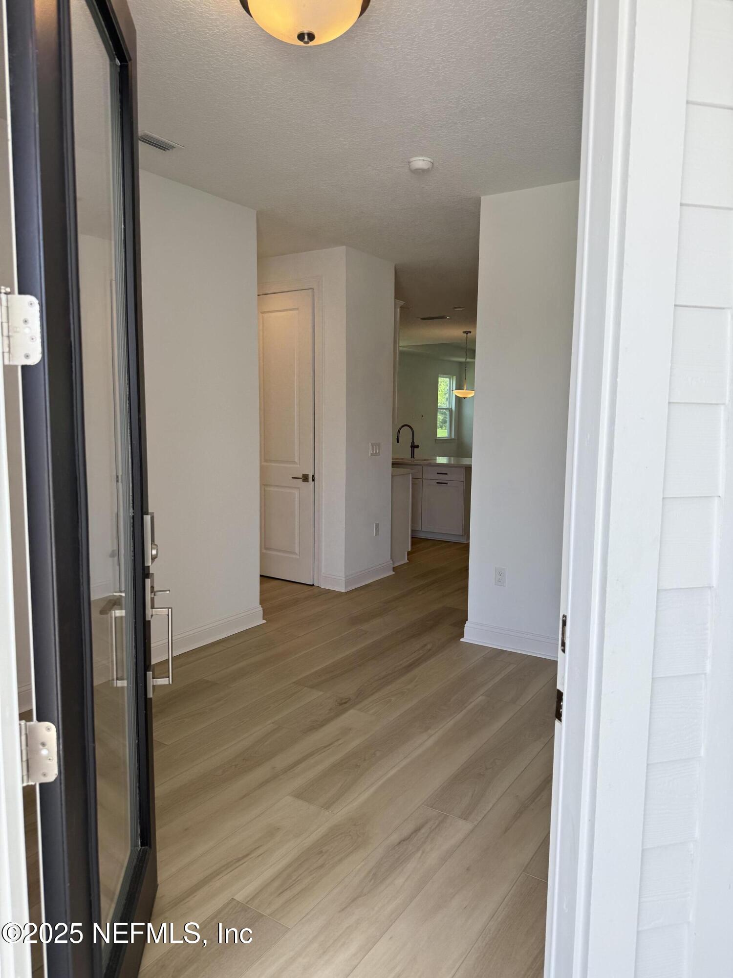 34 Mulberry Road Palm Coast, FL 32164 - Photo 3 of 63 a view of hallway with wooden floor
