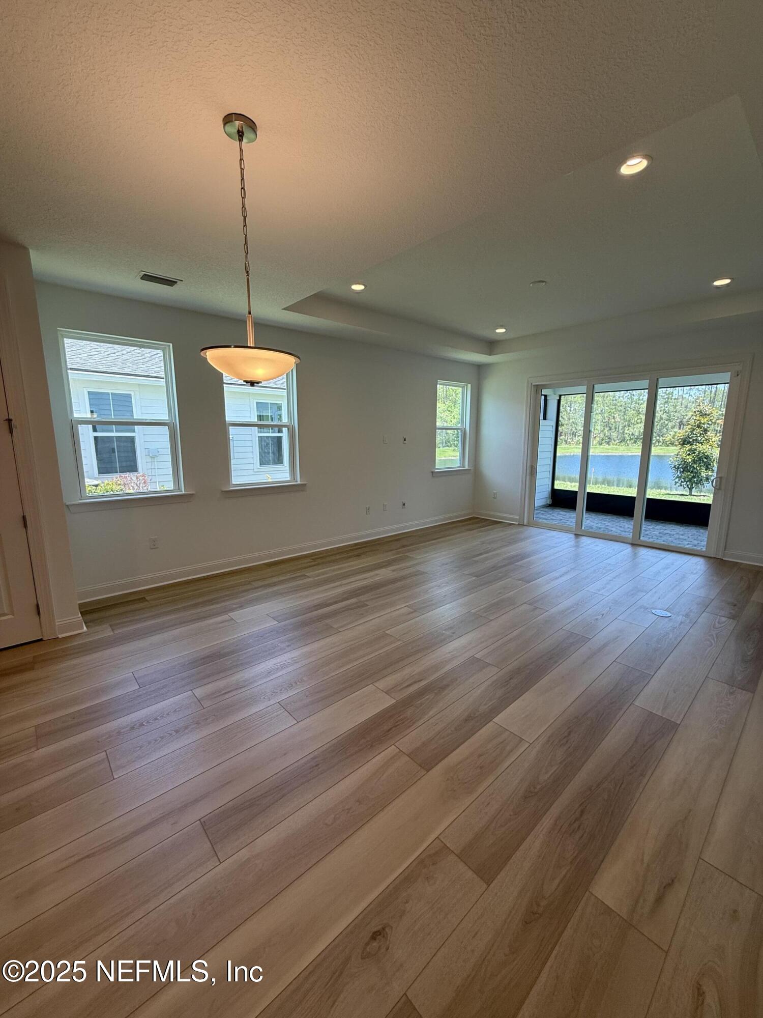 34 Mulberry Road Palm Coast, FL 32164 - Photo 31 of 63 a view of an empty room with window and wooden floor