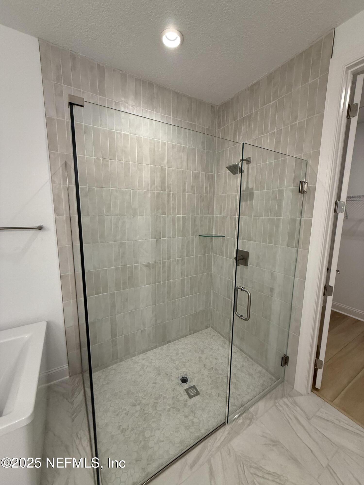 34 Mulberry Road Palm Coast, FL 32164 - Photo 45 of 63 a bathroom with a shower and toilet