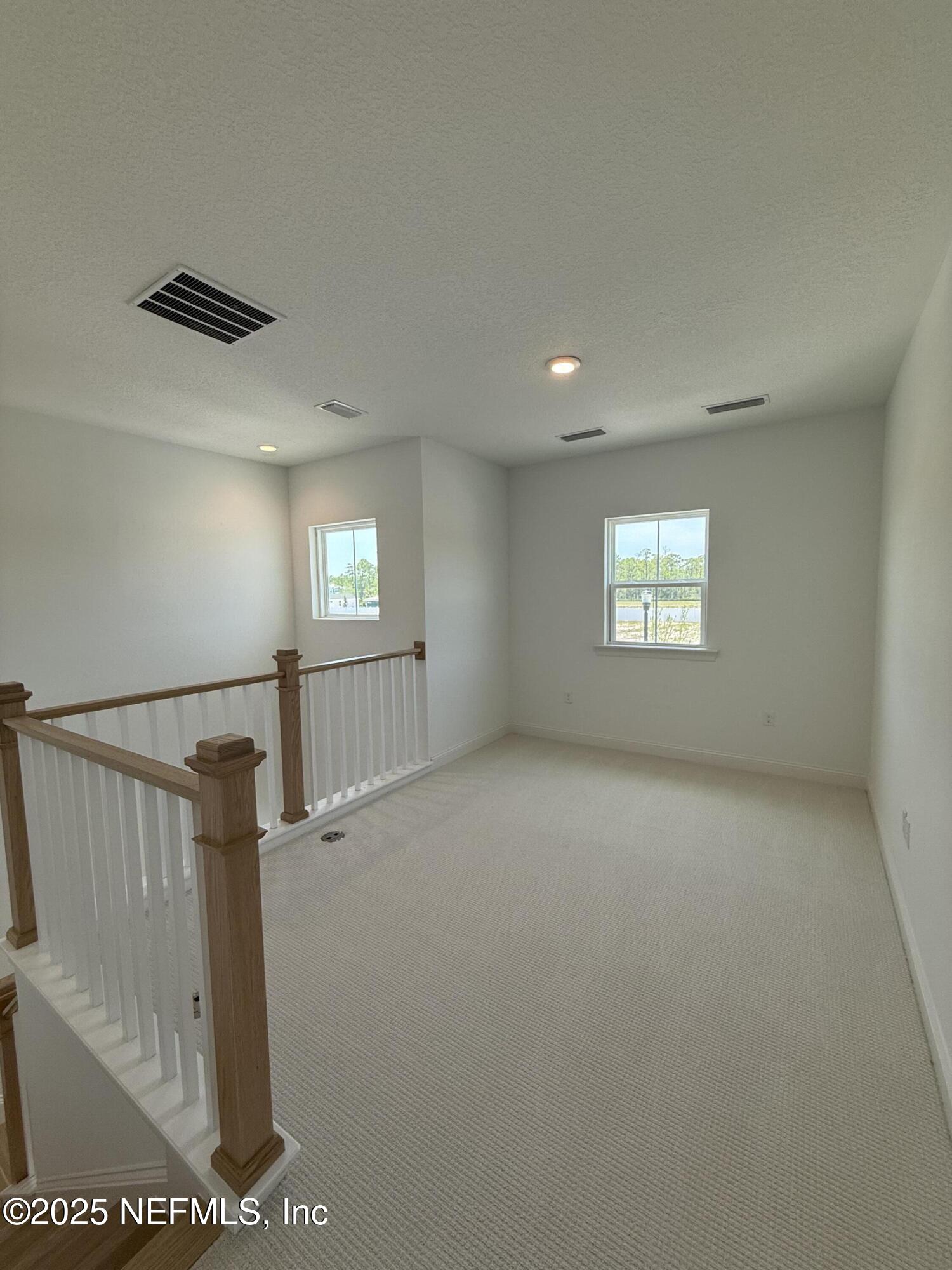 34 Mulberry Road Palm Coast, FL 32164 - Photo 54 of 63 a view of an empty room and a window