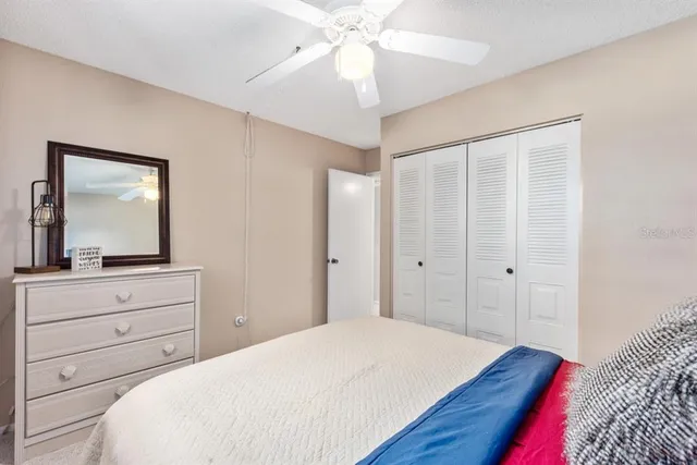 a bedroom with a bed and a dresser