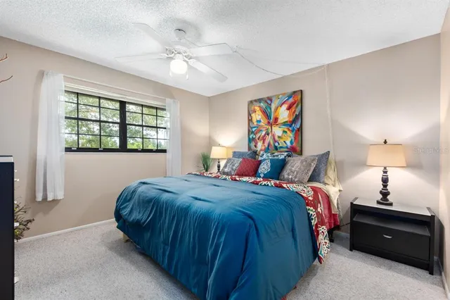 a bed room with a bed and a window