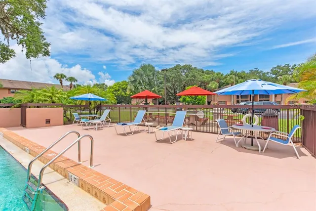 an outdoor space with patio and furniture