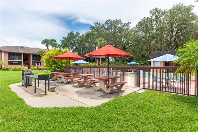 a view of a house with backyard porch and sitting area