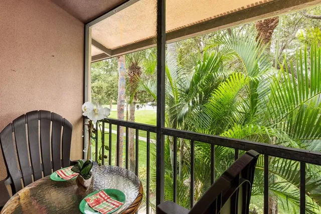 a balcony view with couple of chairs