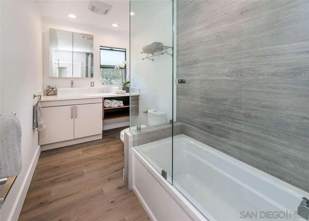 1402 Rodeo Drive La Jolla, CA 92037 - Photo 11 of 62 a bathroom with a bathtub and a sink