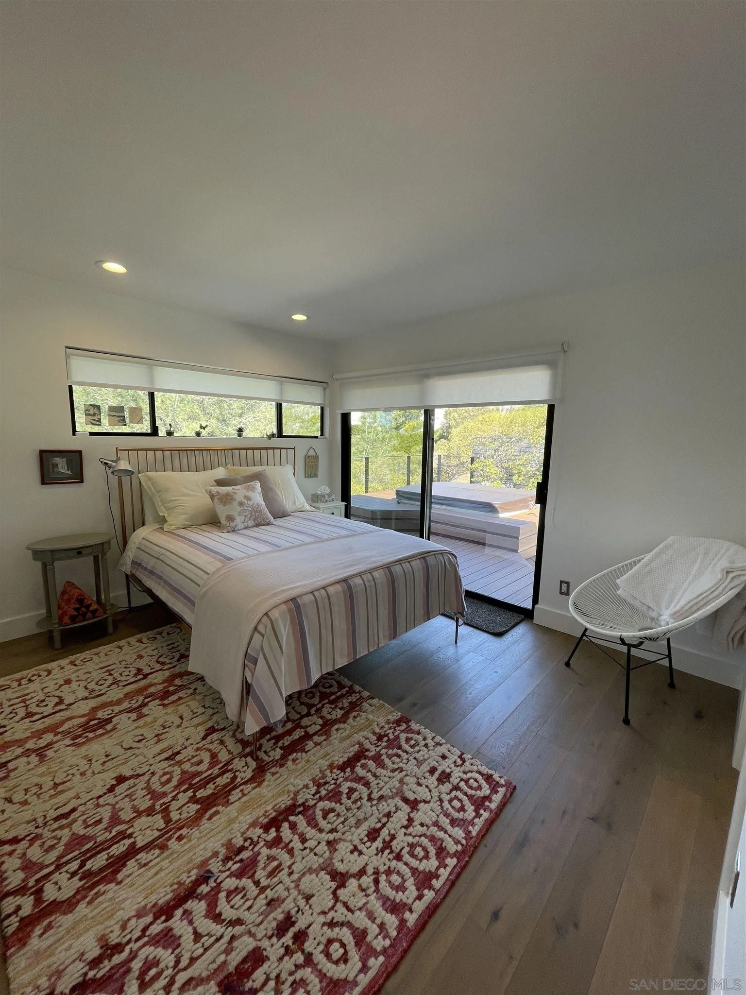 1402 Rodeo Drive La Jolla, CA 92037 - Photo 18 of 62 a spacious bedroom with a bed a table and chair
